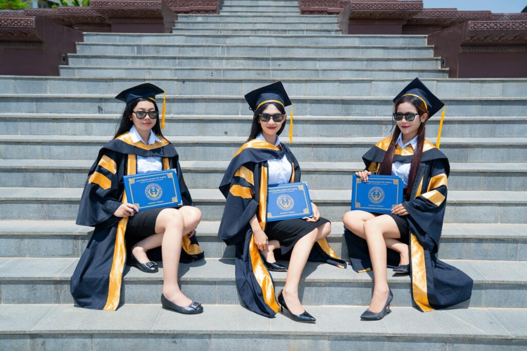 graduates celebrating at outdoor ceremony
